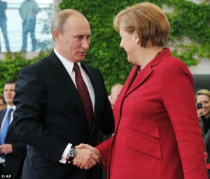 vladmir putin shaking a lady's hand while wearing a watch